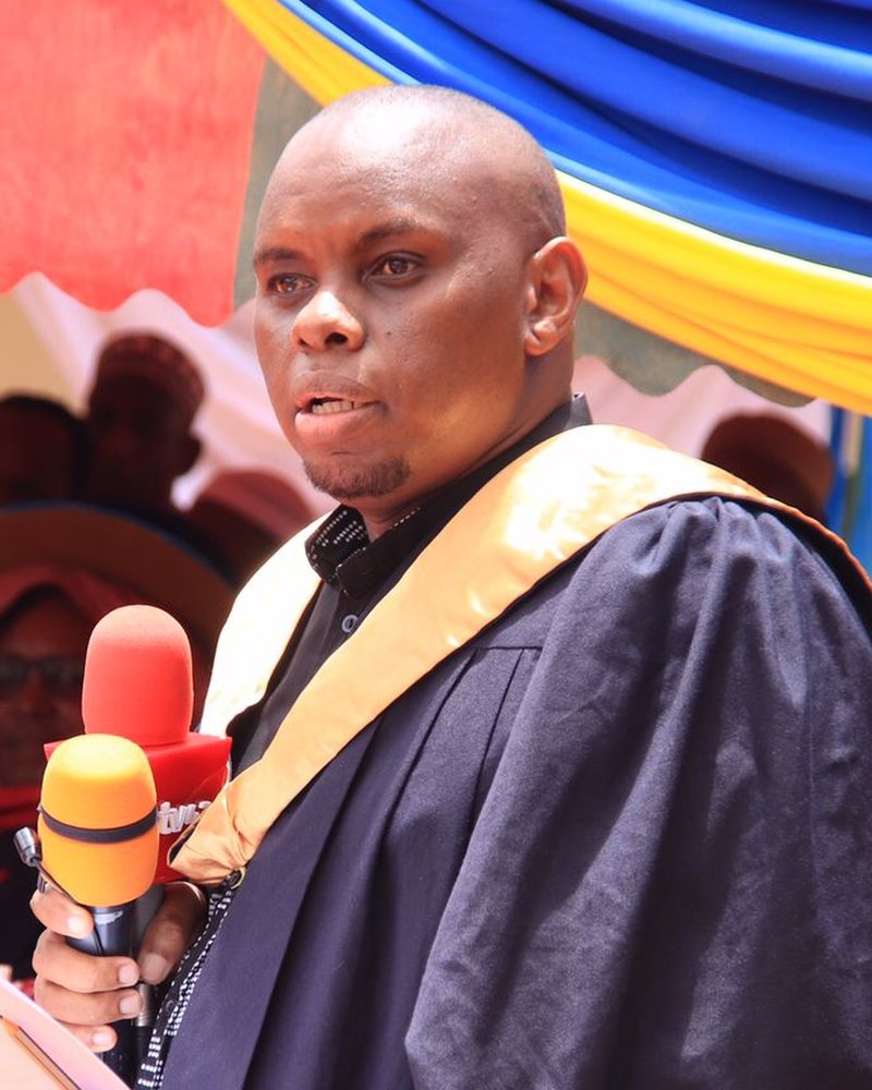 Lawrence Mwangi, Registrar of Nuria College, speaking at a graduation ceremony
